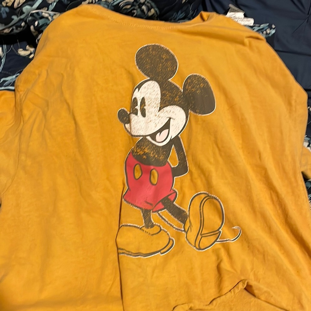 This is a Disney crop top. Colors- red, white, black and a mustard yellow